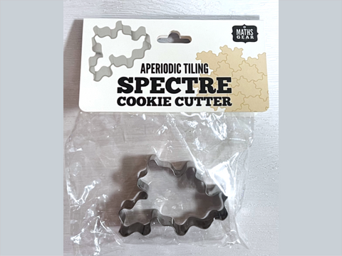 Cookie cutter with 'Spectre' design in packaging labeled 'Maths Gear Aperiodic Tiling Spectre Cookie Cutter'.