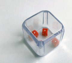 Three identical dice in a cube